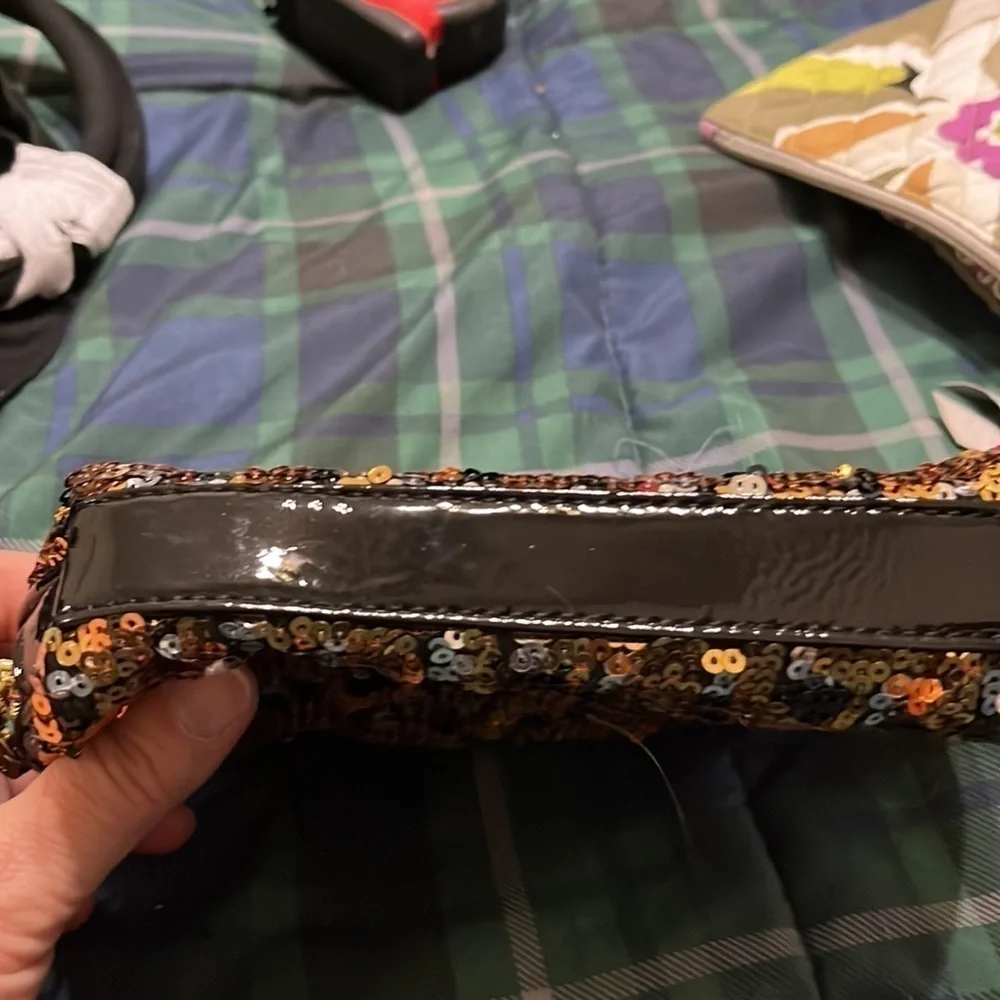 Betsey Johnston gold and black sequined  cosmetic bag. Good condition